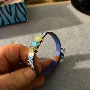 Keep collective bracelet with a sliding charm on it